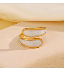 Detail view of 18K gold plated wrap ring featuring white textured enamel inlay