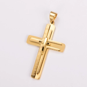Detailed view of golden double-layered cross pendant with intricate textured engraving