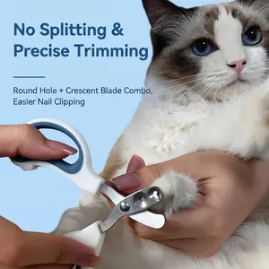 Pet nail clipper with round and crescent blades shown trimming a cat's paws accurately