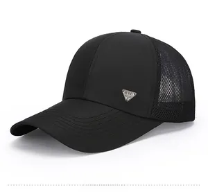 Detail of black breathable mesh baseball cap with silver metal SPIRIT side emblem