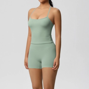 Detailed view of high-stretch mint green yoga set featuring camisole top and gym shorts