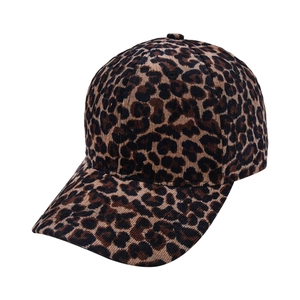 Detailed view of the leopard print pattern and corduroy texture on the baseball cap brim