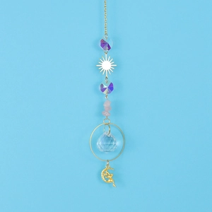 Detailed view of suncatcher with crystal beads, moon fairy charm, and gold metal accents