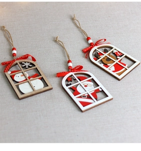 Close-up of wooden Christmas ornaments with Santa, snowman and reindeer figures