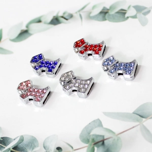 Macro view of colorful rhinestone-encrusted Scottish Terrier dog slider charms