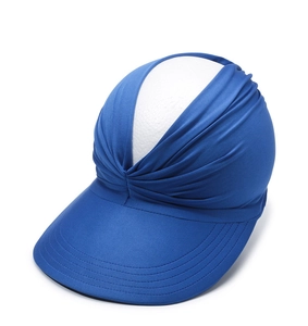 Close-up of blue wide brim sun hat with elastic fabric and pleated twist design
