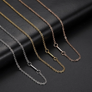 Three minimalist stainless steel necklaces in silver, gold, and rose gold on black background