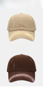 Close-up of embroidered vintage baseball cap featuring distressed textures and MENGDUJIA logo