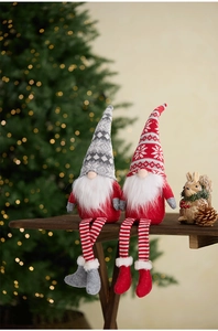 Christmas faceless gnomes with knit hats sitting by a tree with festive bokeh lights