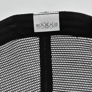 Close-up of baseball cap inner stitching and fabric label showing cotton polyester blend