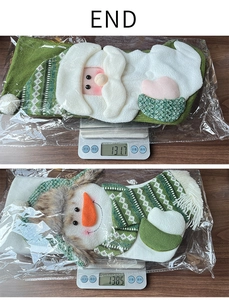 Detailed view of knitted green Christmas stockings on scale showing weight and embroidery