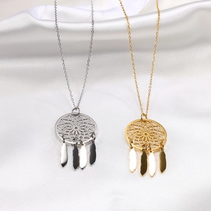 Fashion dreamcatcher necklaces in gold and silver with feather pendants on white silk