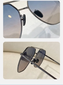 Close-up of gunmetal frame sunglasses with soft silicone nose pads and blue-grey lenses
