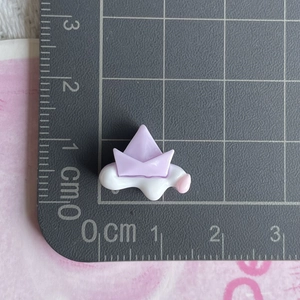 Mini resin charm featuring a purple boat on a white cloud with measuring scale