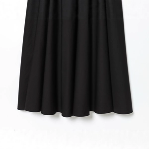 Elegant black pleated blazer dress with a sleek draped silhouette for urban commuters