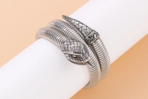 Macro shot of silver stainless steel cobra snake bracelet with fine scale texture detail