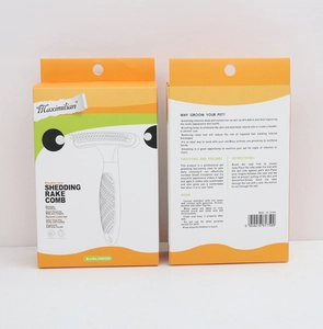 Detail view of the double-row pet grooming rake packaging with ergonomic handle
