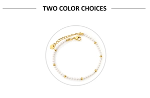 Detailed macro view of white pearls and gold beads on a stainless steel chain