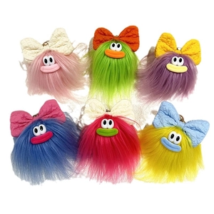 Simpatici portachiavi mostri di peluche colorati con fiocchi in sei colori per borse
