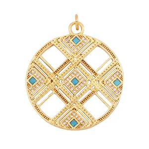 Detailed view of gold copper hollow round pendant with turquoise and zircon inlays