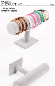 Three-tier grey velvet jewelry stand showing bracelets and watches on stable T-bar racks
