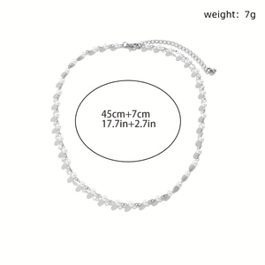 Detail view of silver cross pendant with faux pearls showing 7g weight and 45cm length specs