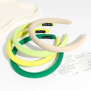 Chic solid color padded sponge headbands in beige, green, and yellow for women