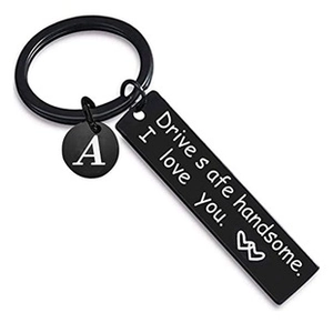 Detail of black stainless steel Drive Safe keychain with engraved letter A charm