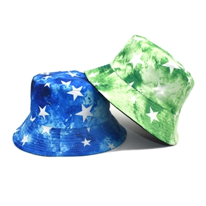 Tie-dye bucket hats with white star pattern in blue and green vintage street style