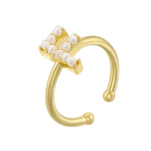 Detail of gold letter F ring with small pearls on an adjustable open band design