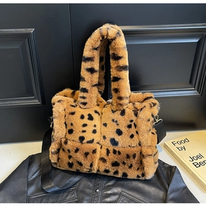 Detailed view of plush leopard print tote bag with soft faux fur texture and dual straps