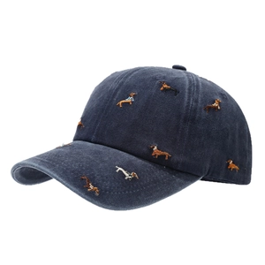 Washed navy blue baseball cap with all-over dachshund dog embroidery and curved brim