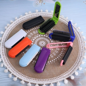 Foldable hair brush set with mirrors in multiple colors on a textured woven mat