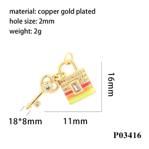 Macro view of 18K gold plated heart key and lock charms with dimensions and weight info