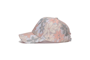Detail of delicate lace floral pattern and breathable fabric on women's sun baseball cap