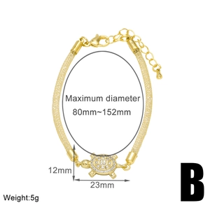 Detail view of gold mesh bracelet with 23mm zircon turtle pendant and size dimensions