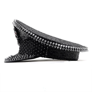 Detailed view of black sequined captain hat with silver punk spikes and metal rivets