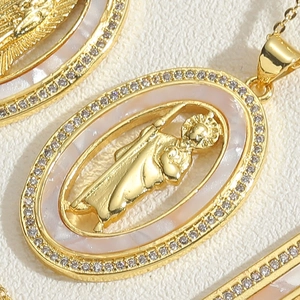 Detailed macro view of the oval religious pendant with mother of pearl and gold plating