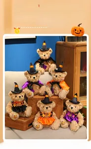 Detail of Halloween witch teddy bears with hats and pumpkin embroidery on plush feet