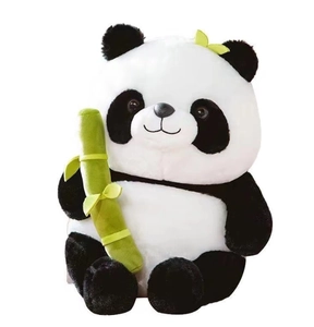 Close-up of cute panda plush toy holding a green bamboo stick with soft texture details