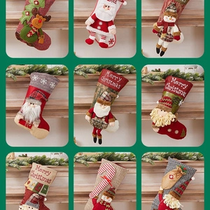 Christmas stockings set with 3D Santa and Reindeer figures for holiday fireplace decor