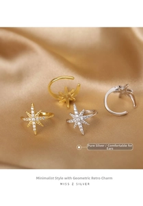 Macro shot of S925 sterling silver star-shaped ear cuff with pave set cubic zirconia