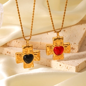 Hammered gold cross pendant necklaces with red and black heart stone inlay on twist chains