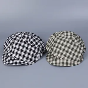 Breathable plaid linen newsboy caps in black and green colors shown on grey background