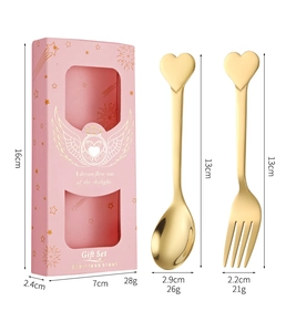 Polished golden heart-shaped spoon and fork set in pink gift box with wings design