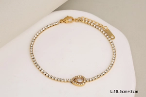 Detail of gold-plated bracelet with teardrop crystal and 3cm extension chain info