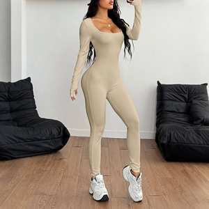 Slim fit beige long sleeve square neck yoga jumpsuit for women in a minimalist room