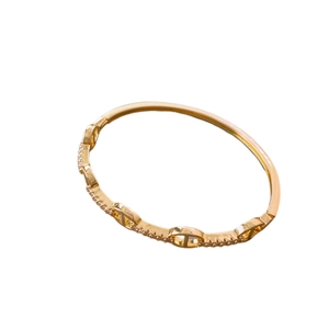 Gold plated pig nose bangle with sparkling cubic zirconia in a minimalist style