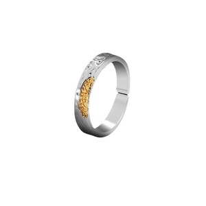 Close-up of two-tone adjustable ring with silver band and gold rock texture inlay