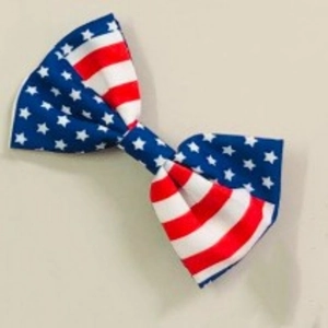 American flag bow hair clip with patriotic red white and blue stars and stripes pattern